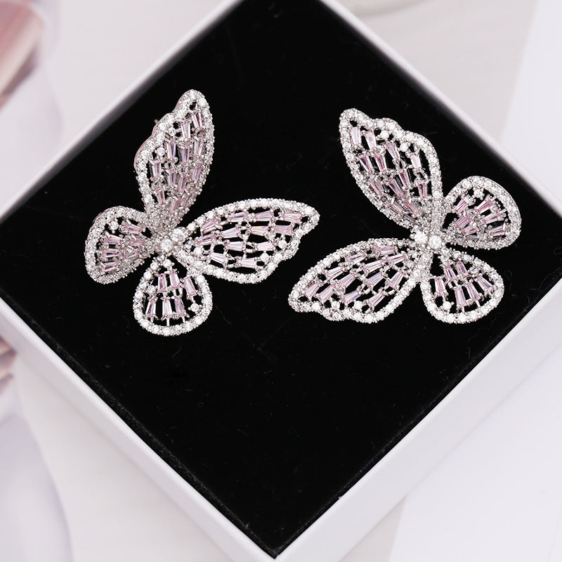 2025 Korean version exaggerated fashion hollow pink zircon S925 silver needle female Internet celebrity earrings butterfly stud earrings wholesale