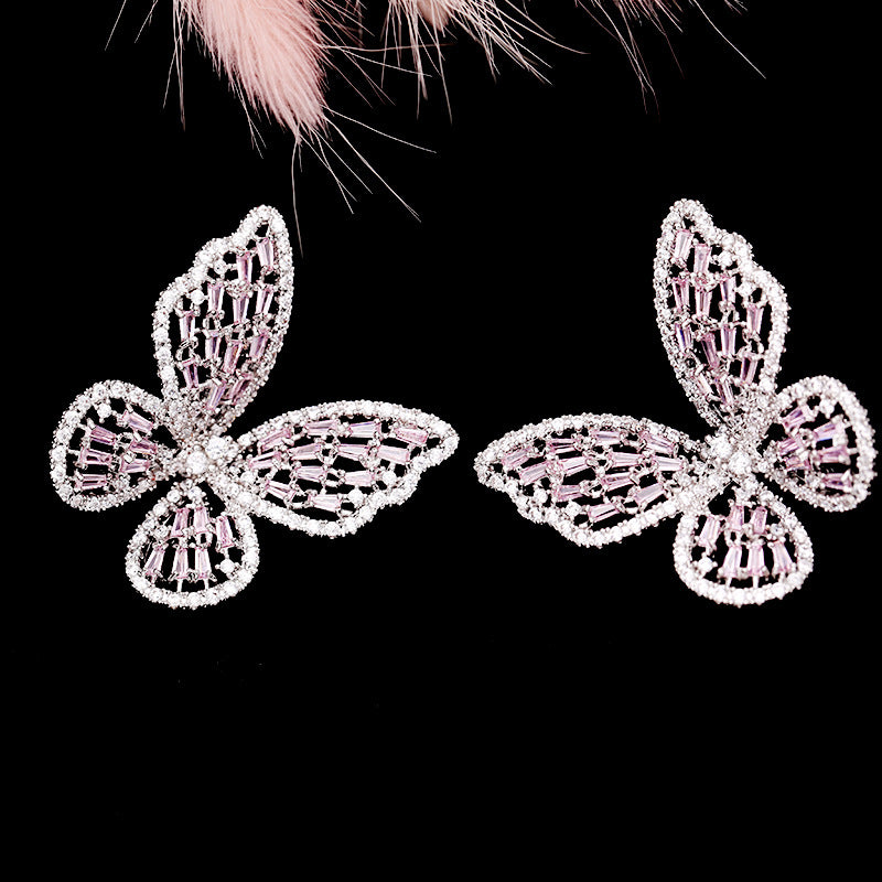 2025 Korean version exaggerated fashion hollow pink zircon S925 silver needle female Internet celebrity earrings butterfly stud earrings wholesale