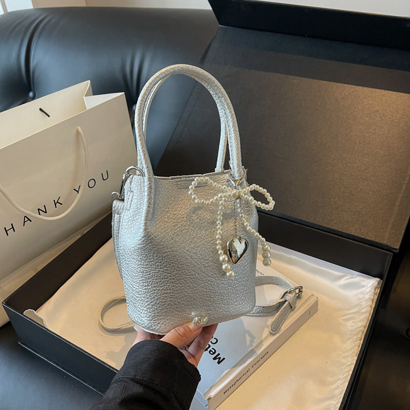SIXSR 2025 Hand strap bucket bag women's Korean version ins fashion temperament pearl shoulder bag popular niche trend shoulder bag