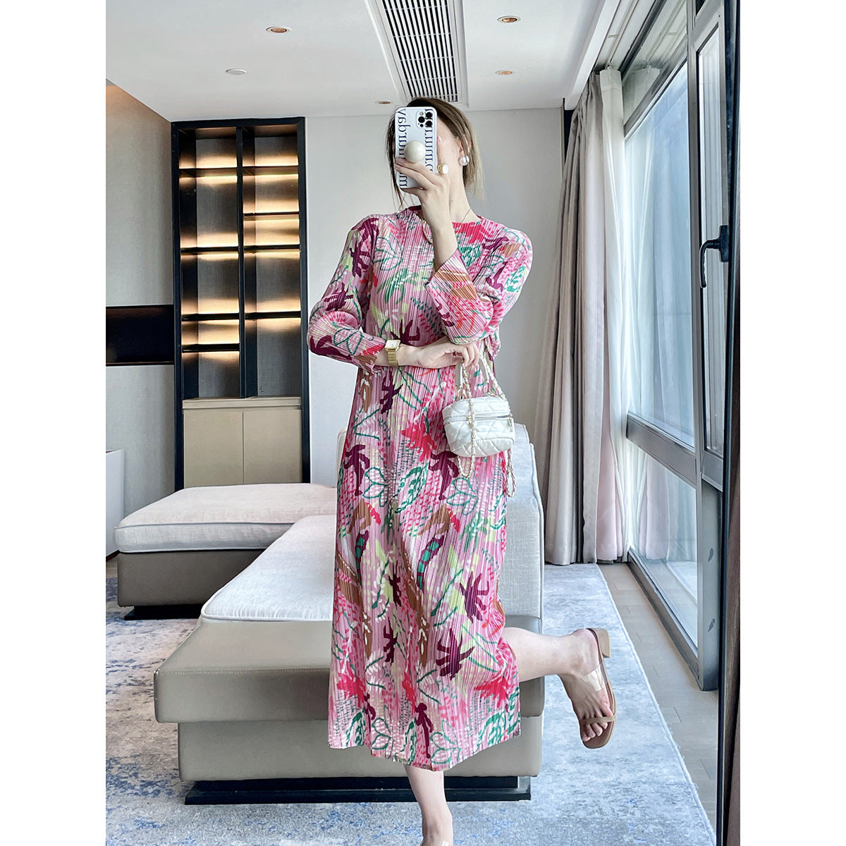Folds autumn new jungle printing design sense Miyake dress temperament elegant, covering meat and showing thin skirt