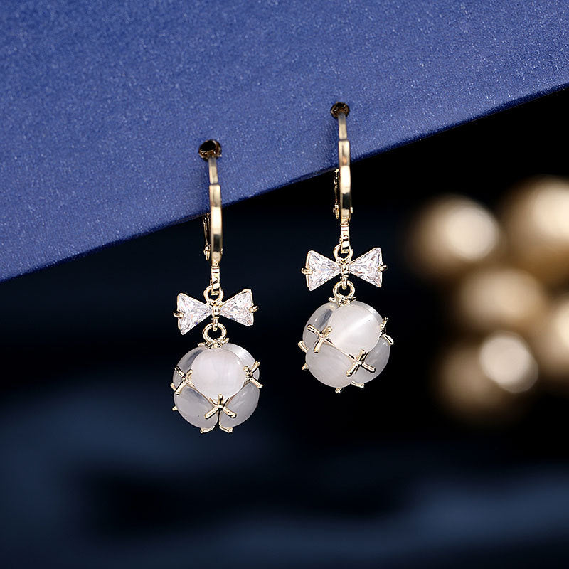 2025 Simple and versatile earrings women's Dongdaemun new earrings bow zircon ear buckle three-dimensional small ball opal earrings