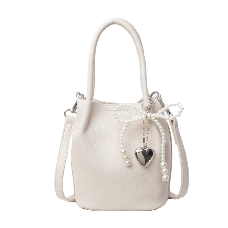 SIXSR 2025 Hand strap bucket bag women's Korean version ins fashion temperament pearl shoulder bag popular niche trend shoulder bag