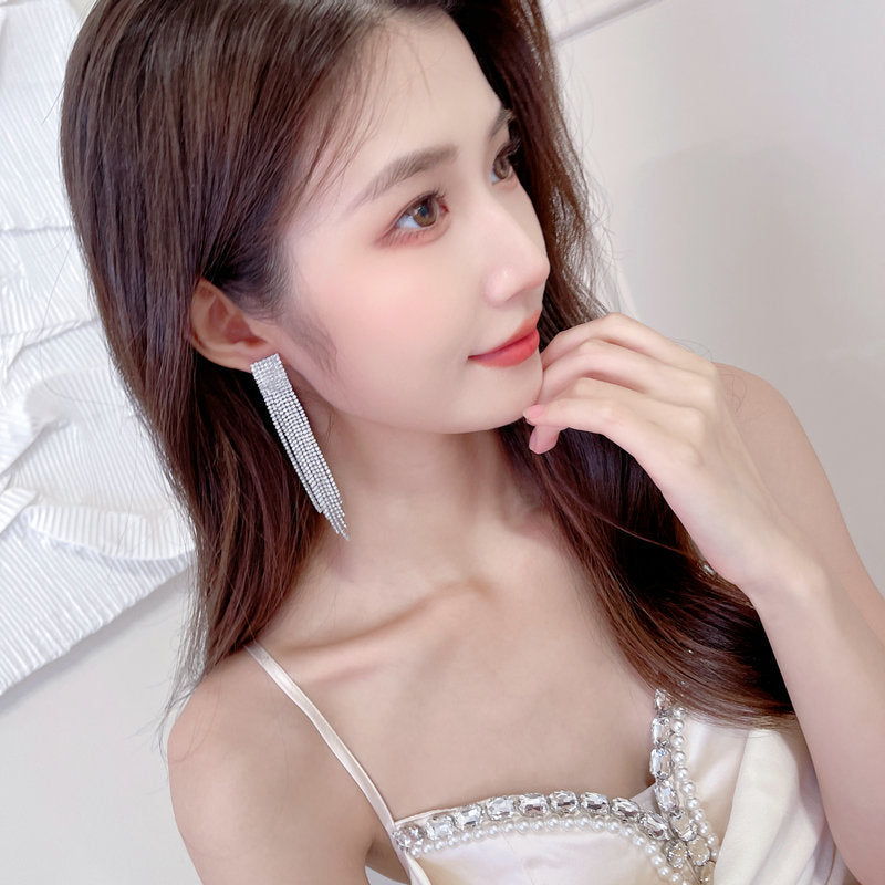 2025 Light luxury style long modified face celebrity temperament earrings tide annual meeting dress with zircon claw chain fringed earrings
