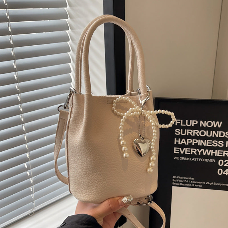 SIXSR 2025 Hand strap bucket bag women's Korean version ins fashion temperament pearl shoulder bag popular niche trend shoulder bag