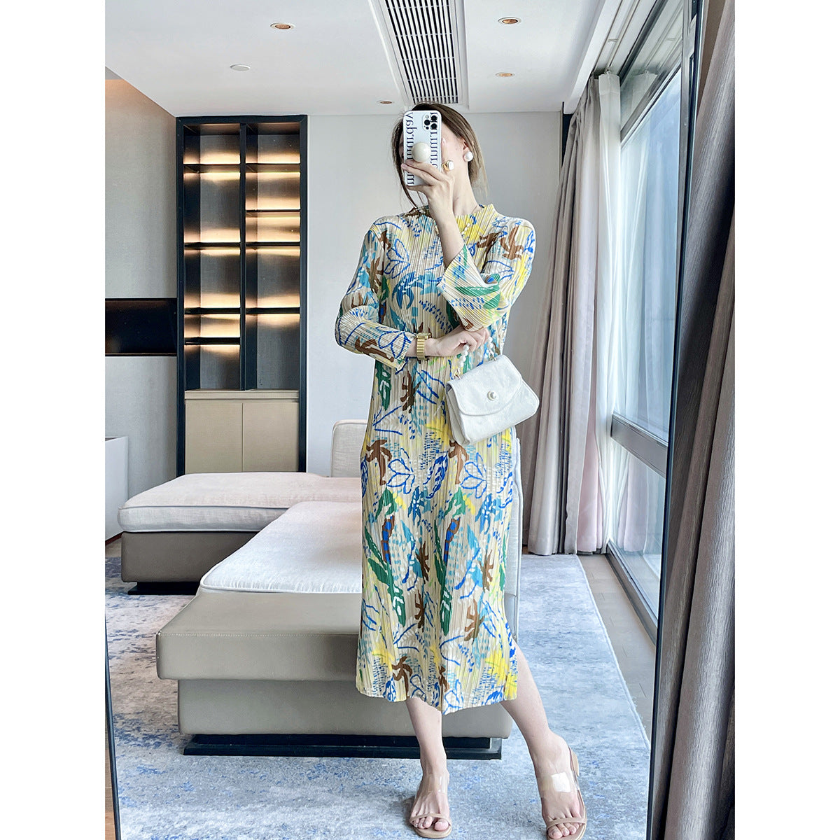 Folds autumn new jungle printing design sense Miyake dress temperament elegant, covering meat and showing thin skirt
