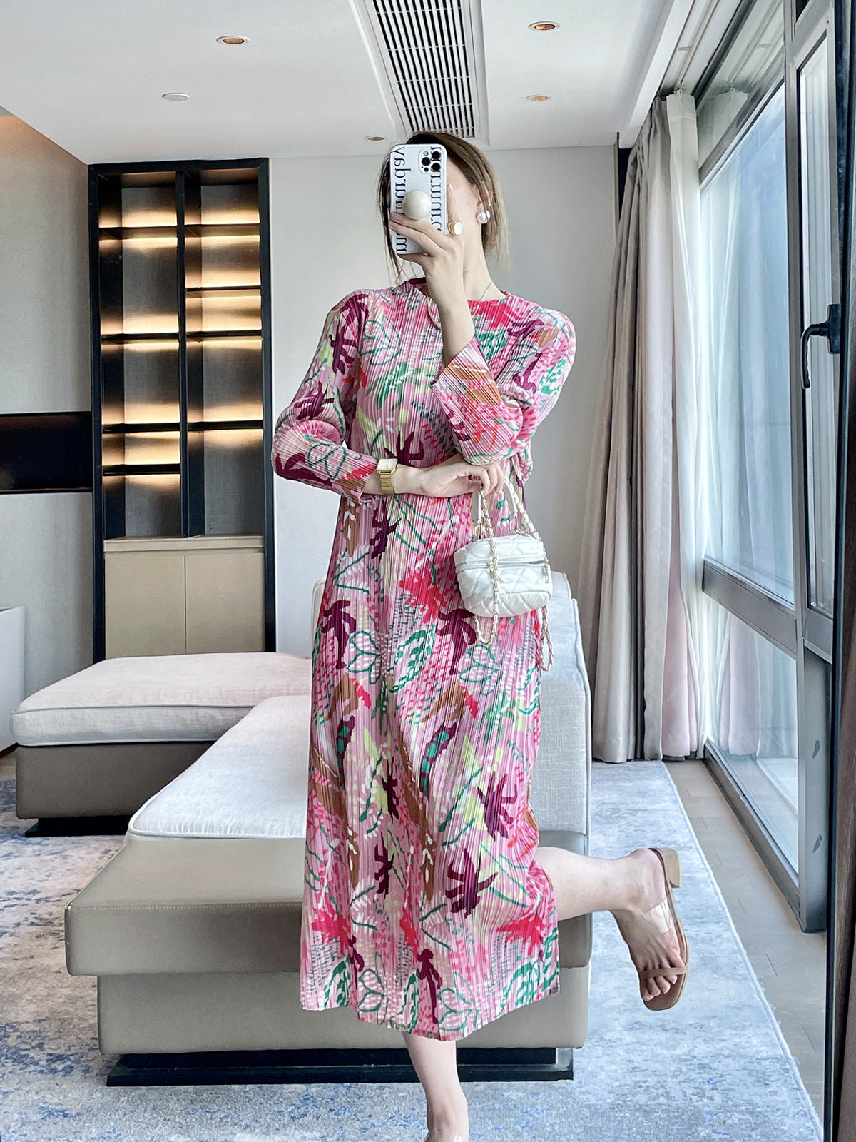 Folds autumn new jungle printing design sense Miyake dress temperament elegant, covering meat and showing thin skirt