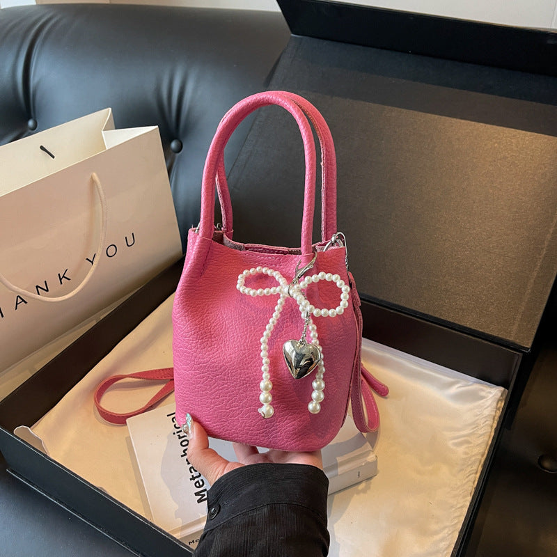 SIXSR 2025 Hand strap bucket bag women's Korean version ins fashion temperament pearl shoulder bag popular niche trend shoulder bag