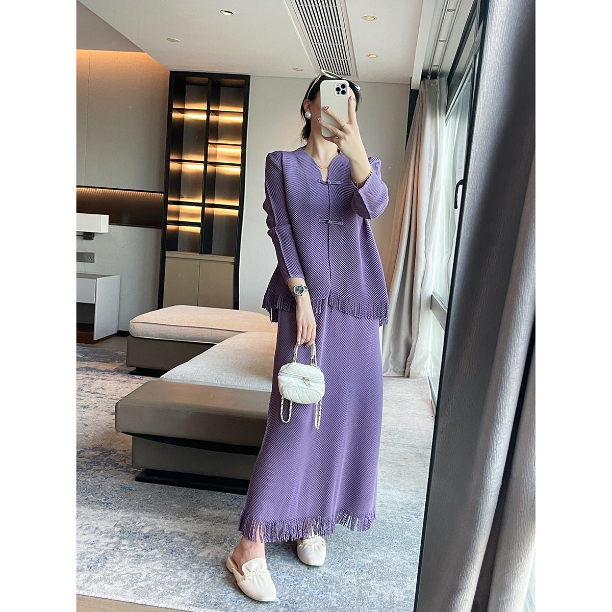 Miyake's new dragon scale pleated fashion suit women's high-end temperament slim top fringed design skirt two-piece set