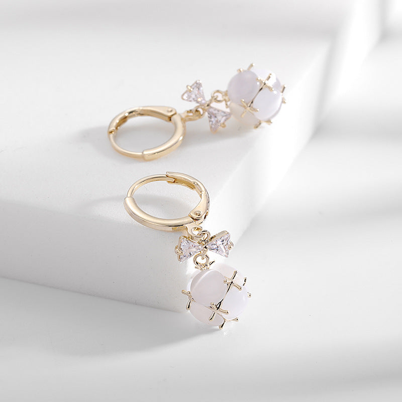 2025 Simple and versatile earrings women's Dongdaemun new earrings bow zircon ear buckle three-dimensional small ball opal earrings