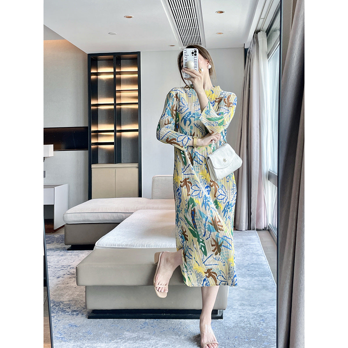 Folds autumn new jungle printing design sense Miyake dress temperament elegant, covering meat and showing thin skirt