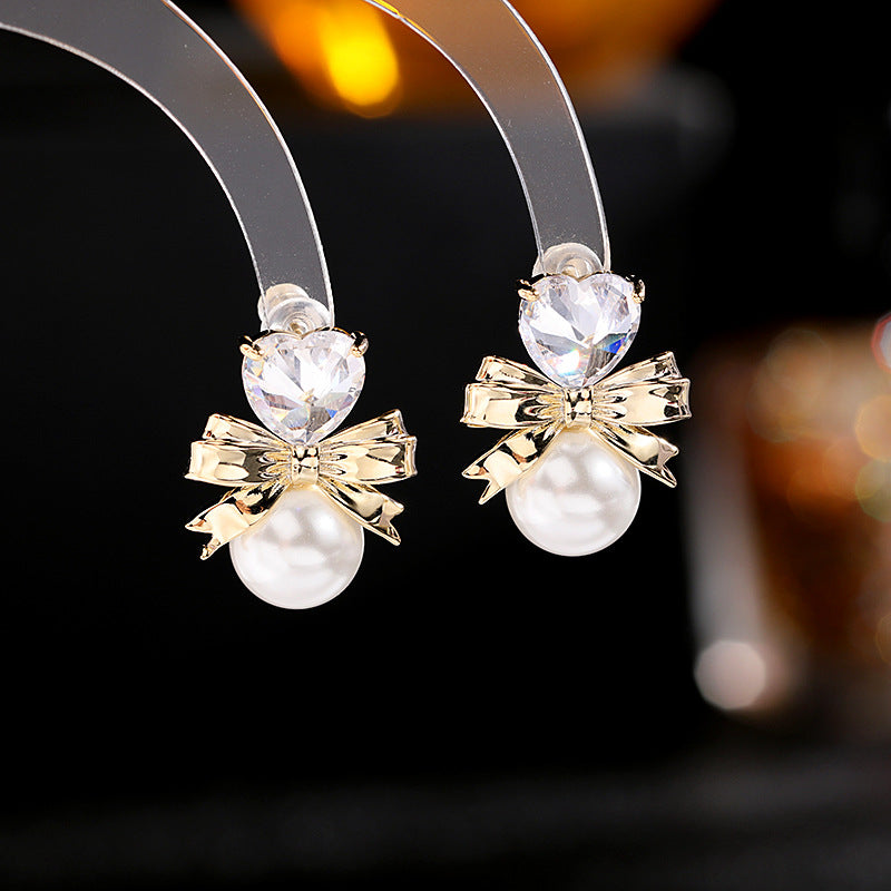 2025 Simple and versatile temperament sweet girl heart earrings s925 silver needle earrings trendy love pearl bow earrings