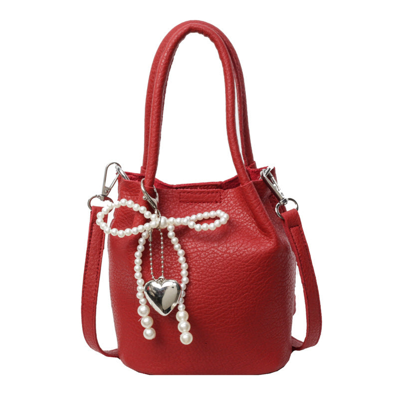 SIXSR 2025 Hand strap bucket bag women's Korean version ins fashion temperament pearl shoulder bag popular niche trend shoulder bag