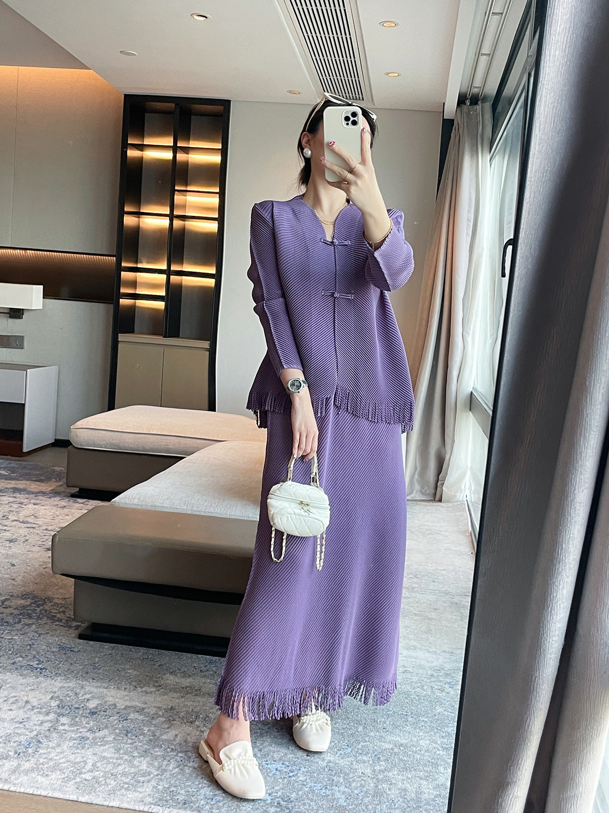 Miyake's new dragon scale pleated fashion suit women's high-end temperament slim top fringed design skirt two-piece set