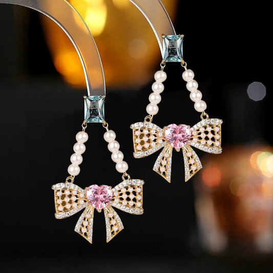 2025 S925 silver needle light luxury high sense super fairy temperament earrings wholesale pearl tassel hollow love bow earrings